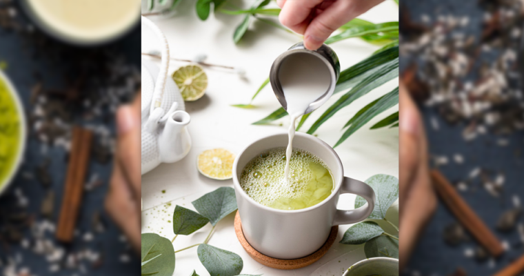 Milk being poured into a cup of matcha